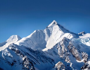 Obraz premium awe inspiring and grandeur inducing sight of a snow-covered mountain with its white peaks against a backdrop of a clear blue sky