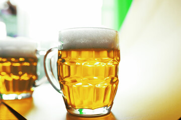 Saint Patrick's Day holiday. National Irish holiday. A mug of golden beer at the bar.