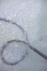 Soap bubbles background. Shampoo foam in the water in the bathroom. Jacuzzi elements.