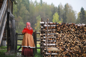 Traditional Slavic rituals in the rustic style. Outdoor in summer. Slavic village farm. Peasants in...