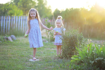 Fototapeta premium Children walk in the summer in nature. Child on a sunny spring morning in the park. Traveling with children.