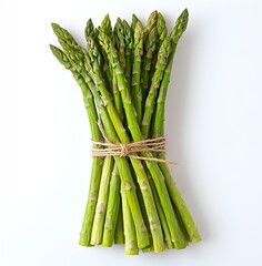 A bunch of fresh asparagus stalks gathered together on a white surface