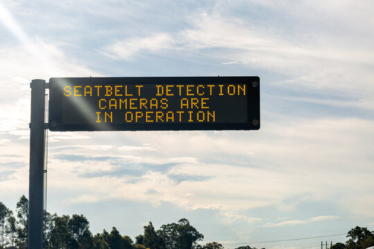 Seatbelt detection cameras are in operation digital sign above highway