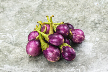 Small organic young purple round eggplant
