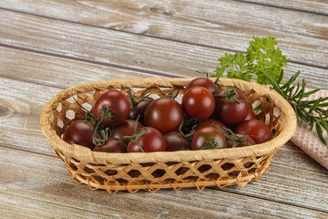 Juicy ripe black cherry tomato