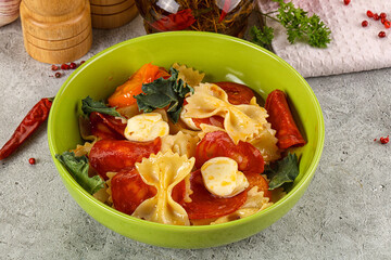 Italian pasta farfalle with pepperoni