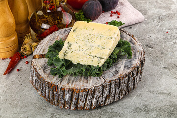 Blue cheese piece over board