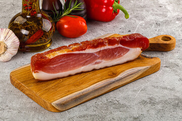Piece prosciutto crudo over board