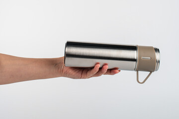 Bottle tumbler aluminium water glass and hand isolated white background.