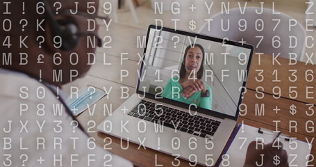 Image of data processing over african american businessman using laptop on image call