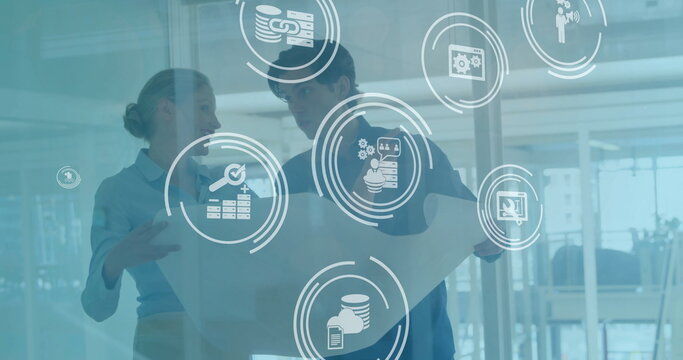 Image of financial data processing over diverse business people in office