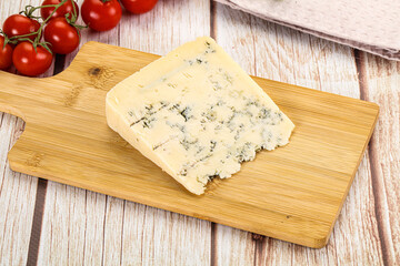 Blue cheese with mold over board