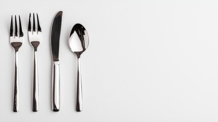 Silverware place setting on white background, food preparation
