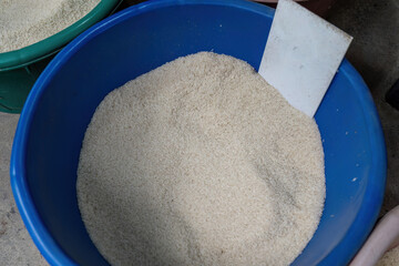 A bucket of long grain rice at a local thai market
