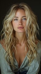 Naklejka premium studio portrait of a woman, blonde with long hair and blue eyes