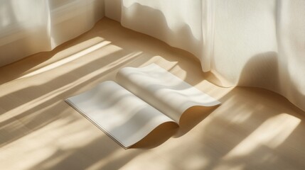 Open Notebook on Beige Floor with Sunlight Shadows