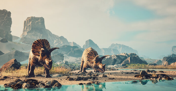 Dinosaurs exploring a serene landscape with a calm body of water and rocky mountains in the background during daylight