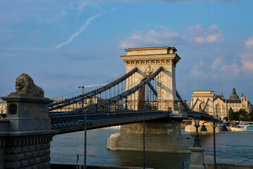 Szechenyi Chain bridge in Budapest at Sunset. Famous bridge over Danube river connecting Buda and Pest. Historical architecture in Hungary
