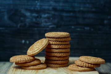 stack of delicious almond biscuits on a wooden board