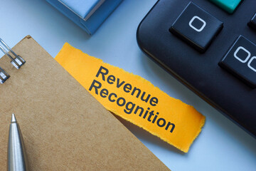 Notebook labeled Revenue Recognition. Financial reporting.