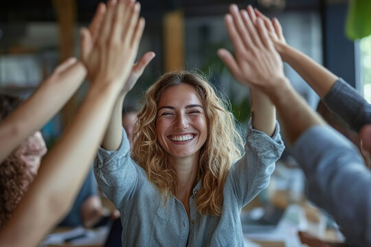 Celebrating team success at a business meeting office group photo indoor positive vibes