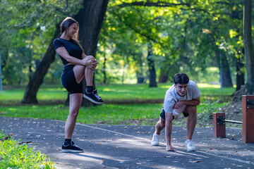 Couple exercising together in a park, promoting fitness and a healthy lifestyle. The serene outdoor setting emphasizes bonding, physical activity, and well being amidst nature.