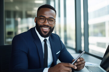 Fototapeta premium Black Businessman holding phone