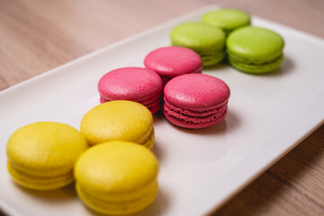 colorful macaroons on a wooden table