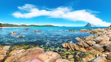 Superb azure water with rocks near beach Porto Taverna.