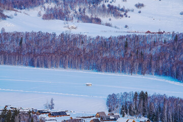 Hemu Village, Snowy Mountains, Forests, and Winter Snow Scenery in Xinjiang Uygur Autonomous Region, China On March 1st, 2023