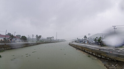 Fototapeta premium Overcast River Landscape on a Rainy Day