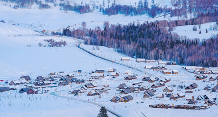 Hemu Village, Snowy Mountains, Forests, and Winter Snow Scenery in Xinjiang Uygur Autonomous Region, China On March 1st, 2023