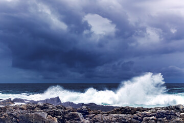 Large Indian Ocean waves and rocky coastline in Tsitsikamma, Garden Route National Park, Eastern Cape. South Africa	
