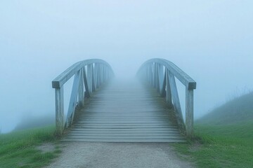 Fototapeta premium Misty wooden bridge leads to a lonely tree on a rocky island during early morning fog