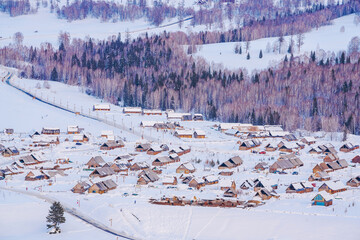 Hemu Village, Snowy Mountains, Forests, and Winter Snow Scenery in Xinjiang Uygur Autonomous Region, China On March 1st, 2023
