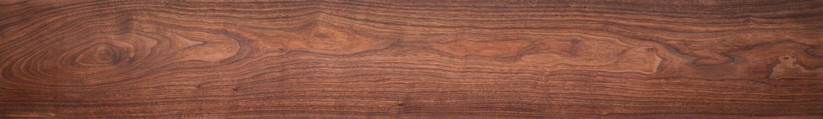 Walnut wood texture. Extra long walnut wood plank natural texture background. Long wood plank texture.