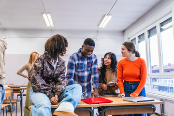 High school students collaborating on a project in classroom