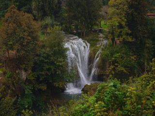 Fototapeta premium Travel to Village of Rastoke near Slunj in Croatia. Breathtaking view old water mills on waterfalls of Korana river, beautiful countryside landscape
