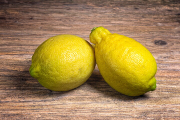 2 Lemons on wooden table
