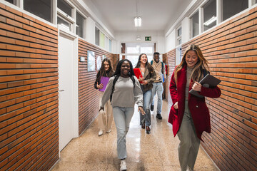 High school students walking down school hallway