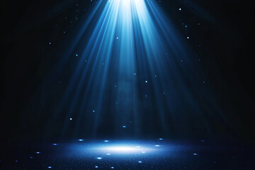 Bright blue spotlight illuminating dark background with sparkling effects