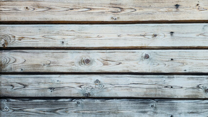 Fototapeta premium wooden texture of aged boards, covered with cracks, knots and traces of time.