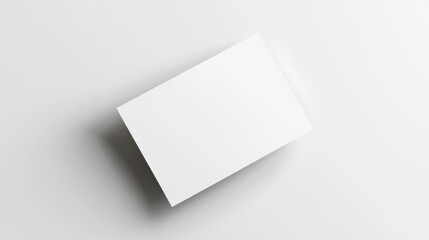 Blank white business card on clean white background, perfect for branding or identity designs.