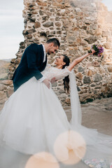 Groom dipping bride during first dance.