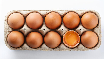 Fresh brown chicken eggs in carton box. Organic and healthy farm product. Top view. Isolated on white backdrop. Close-up
