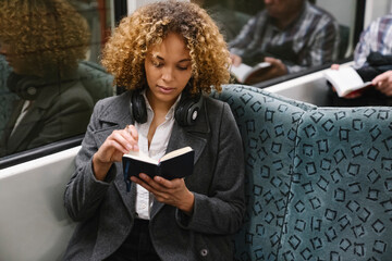 Woman with notebook on a subway