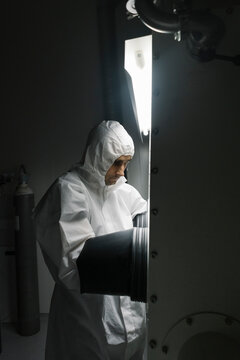 Scientist working in clean room of a laboratory