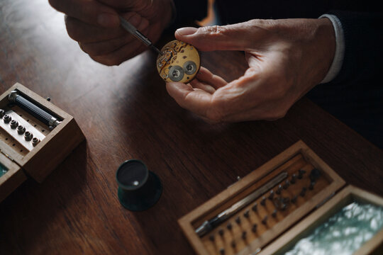 Close-up of senior man repairing a watch