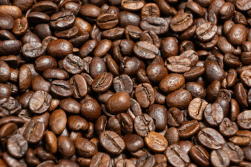 Scattered coffee beans top down macro shot