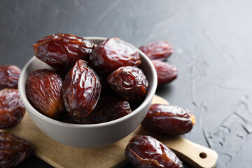 Tasty dried dates on grey table, closeup